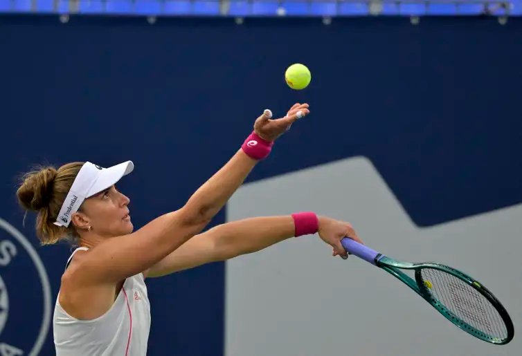 Jul 29, 2025; Montreal, QC, Canada; Beatriz Haddad Maia (BRA) serves against Suzan Lamens (NED) in second round play at IGA Stadium. Mandatory Credit: Eric Bolte-Imagn Images