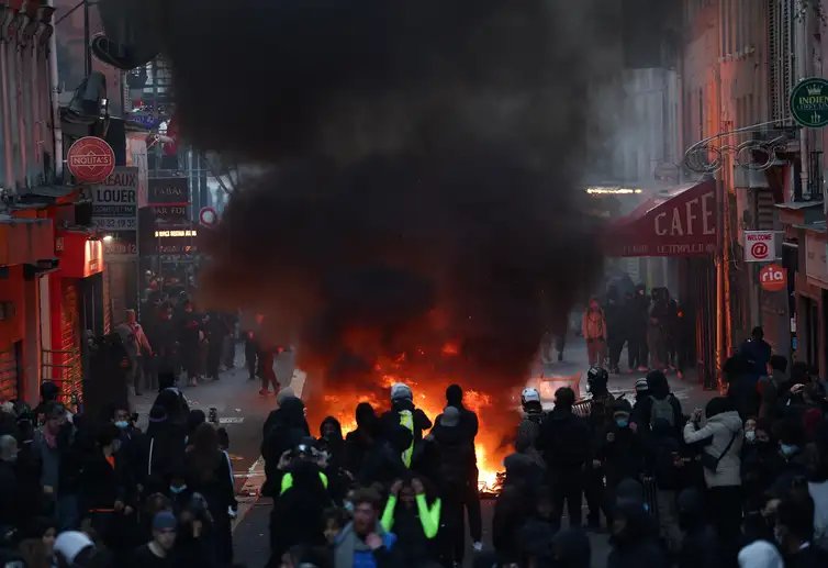Flames and smoke rise, during civil unrest, the day after a national day of demonstrations against the cost of living and rising fuel prices, in Paris, France, October 18, 2026. REUTERS/Abdul Saboor